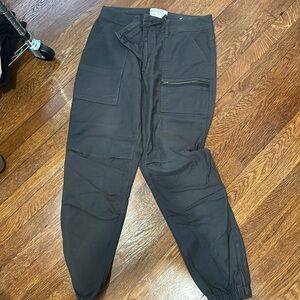 Olive colored pants with 6 pockets.